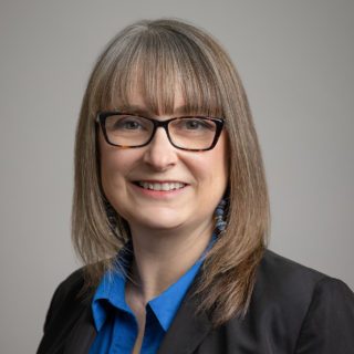 GRAPHIC DESIGNER & MARKETING OFFICER <br>Carolyn McNall