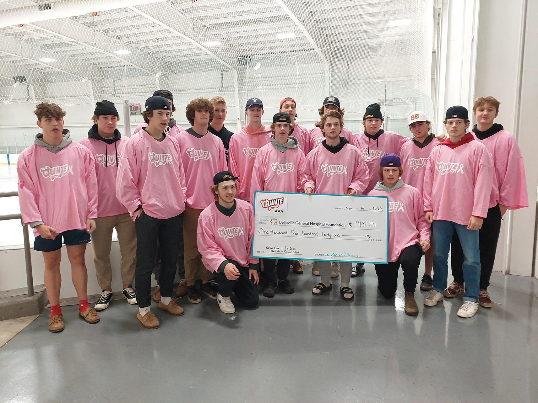 Quinte Red Devils AAA team wearing their pink hockey jerseys